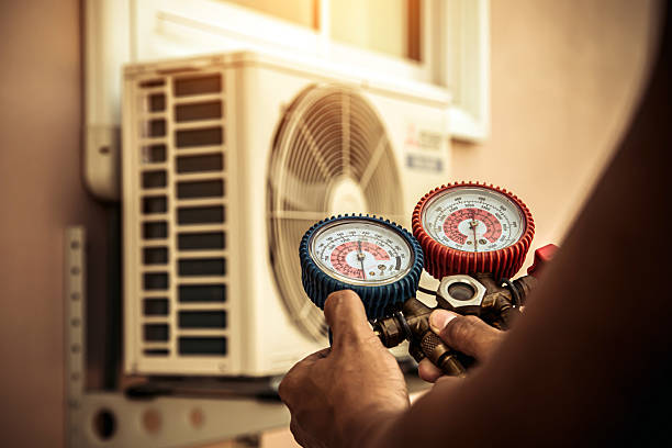 Professional Hvac technician working in Plainville, MA